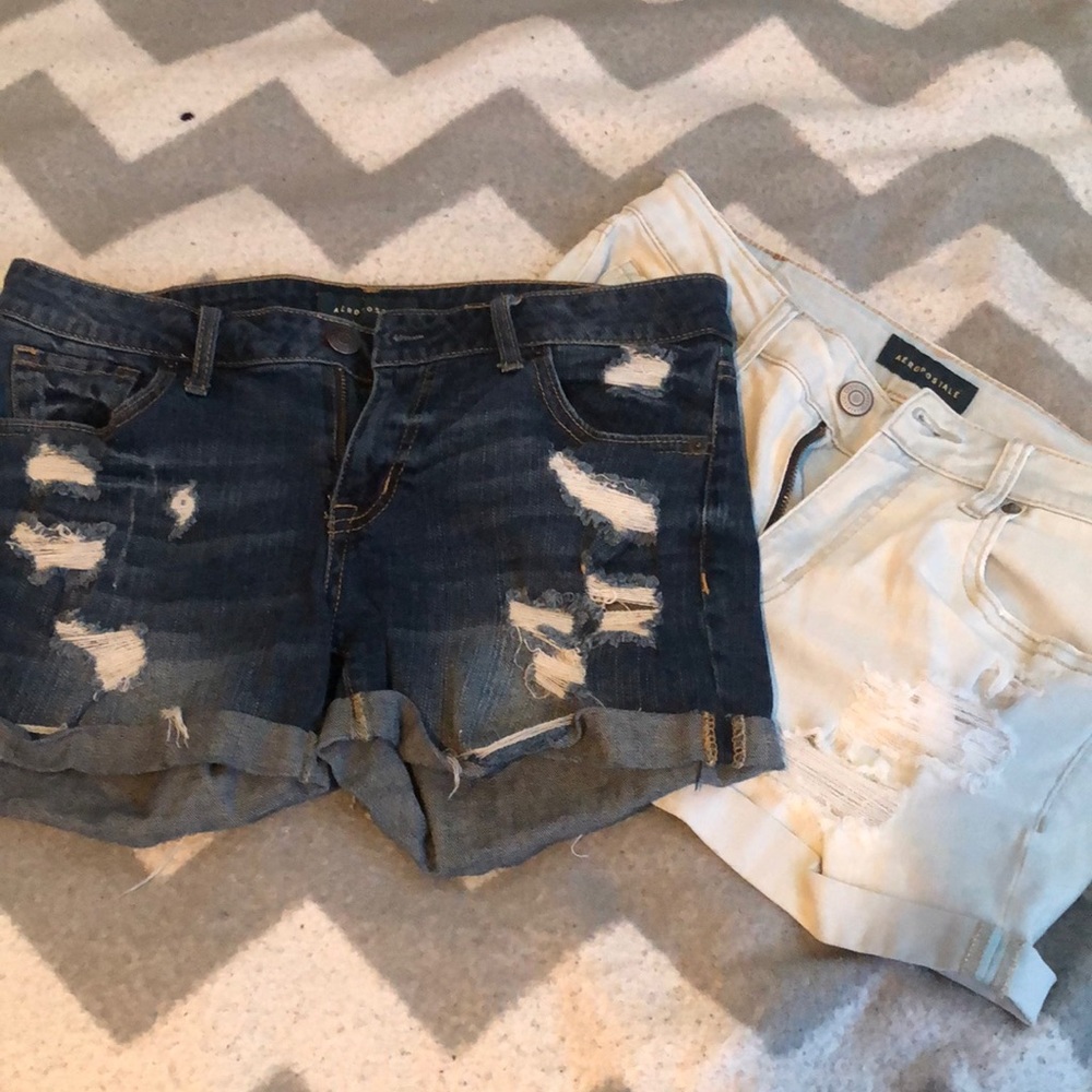 High waisted light wash shorts and dark wash midi shorts